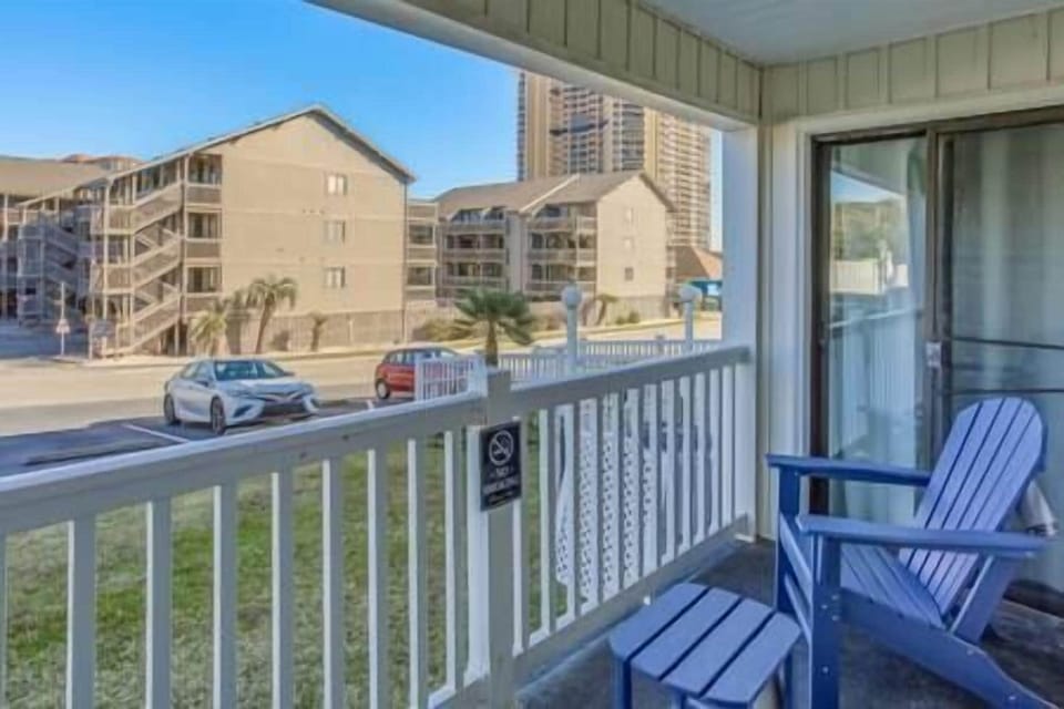 Balcony View to the sand, with Adirondack Polywood furniture.