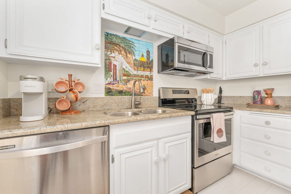 Dully stocked kitchen with all the cooking amenities. 