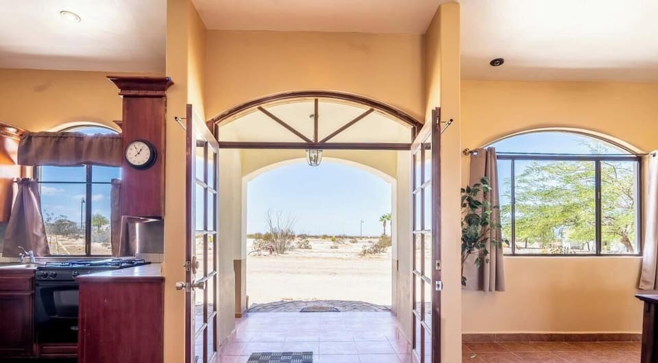 The Casa Tapia main entrance opens to a clean entryway with direct access to the main living space.
