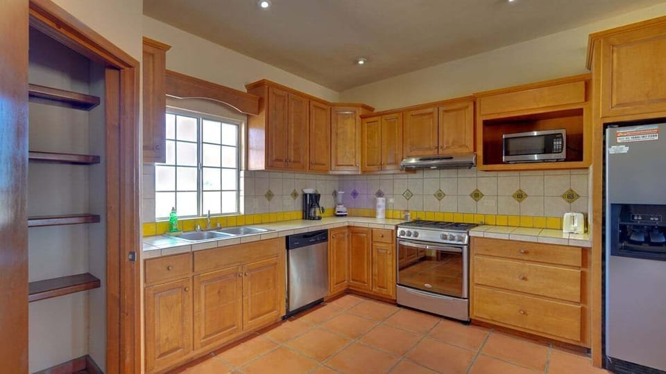 Cook with ease in the fully equipped kitchen of Casa La Vida Dulce at El Dorado Ranch San Felipe BC MX — modern appliances and plenty of counter space.