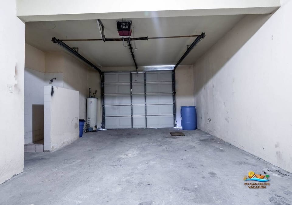 This private garage provides secure off-street parking for your vehicle—keeping it out of the sun and sand, just steps from the beach.