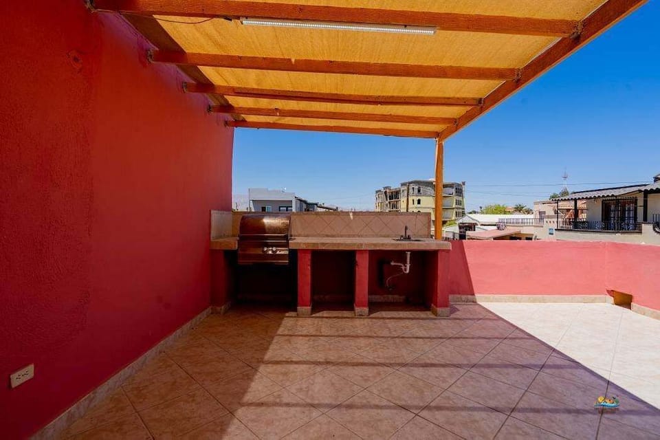 This private outdoor area features a BBQ grill and open seating, making it easy to cook and dine al fresco just steps from the beach.