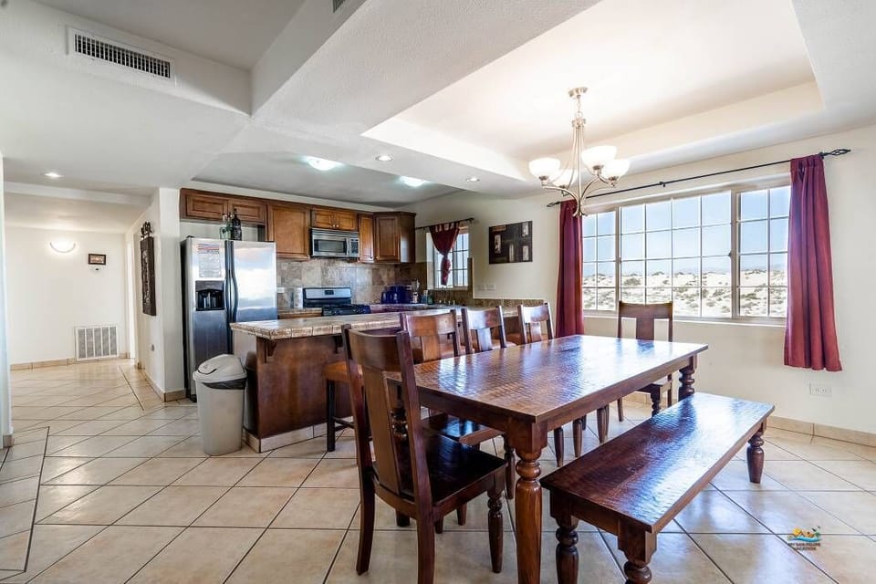 Seamless connection between dining table and kitchen at Casa Monterrey in La Hacienda San Felipe Baja California — perfect for entertaining.