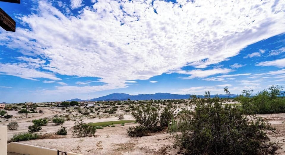 See what's behind the house. This back window view at Casa Campbell vacation rental inside El Dorado Ranch in San Felipe BC MX shows you the outdoor space and privacy.