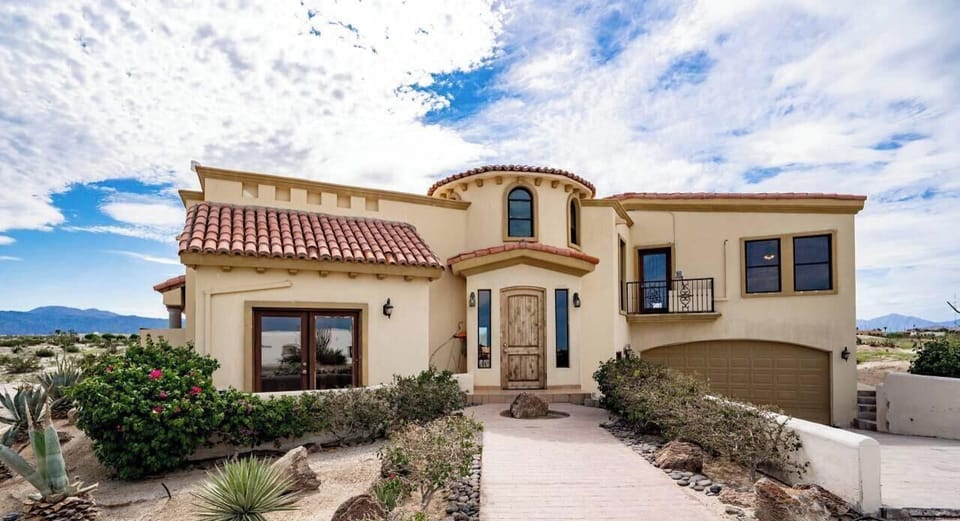 See what greets you when you arrive. This front view of Casa Campbell vacation rental inside El Dorado Ranch in San Felipe Baja California Mexico shows your private entrance and curb appeal.