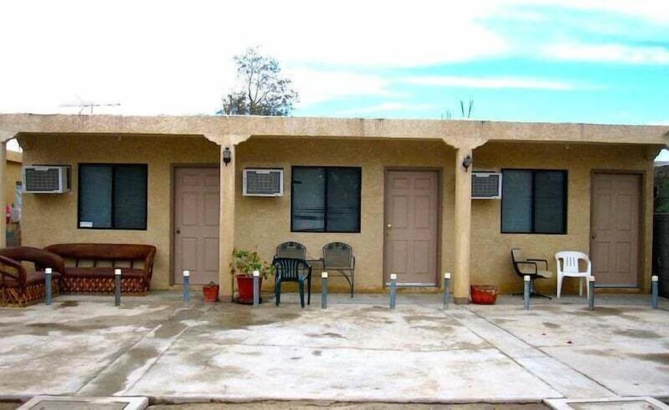 Private bathroom with toilet and bathtub — located 2 miles north of the San Felipe Malecon with secured parking, A/C, and free WiFi