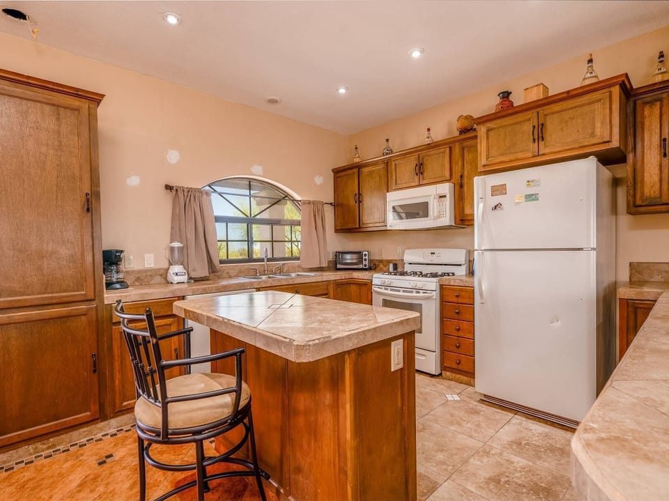 Cook meals with ease in the full kitchen at Casa Frazier in El Dorado Ranch San Felipe BC MX — stove, fridge, and counter space included.