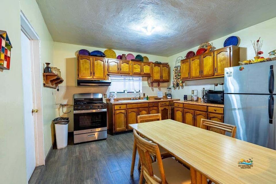 Cook with ease in the main kitchen of Casa Oasis in downtown San Felipe Baja California MX — stove, fridge, and counter space included.