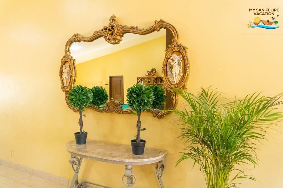 Natural light meets thoughtful design in this Rancho Percebu vacation rental in San Felipe BC MX. The living room area features a full-length mirror, adding depth and function to your home away from home.