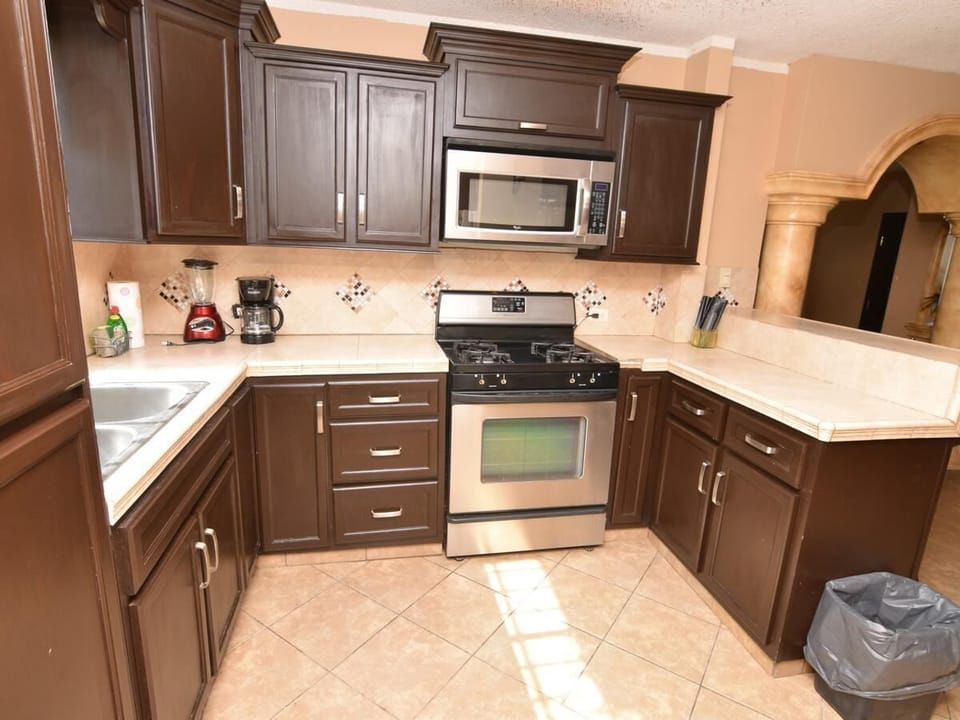 Full kitchen with stove, fridge, and counter space at Casa Portobello in San Felipe BC Mexico — perfect for home cooking.