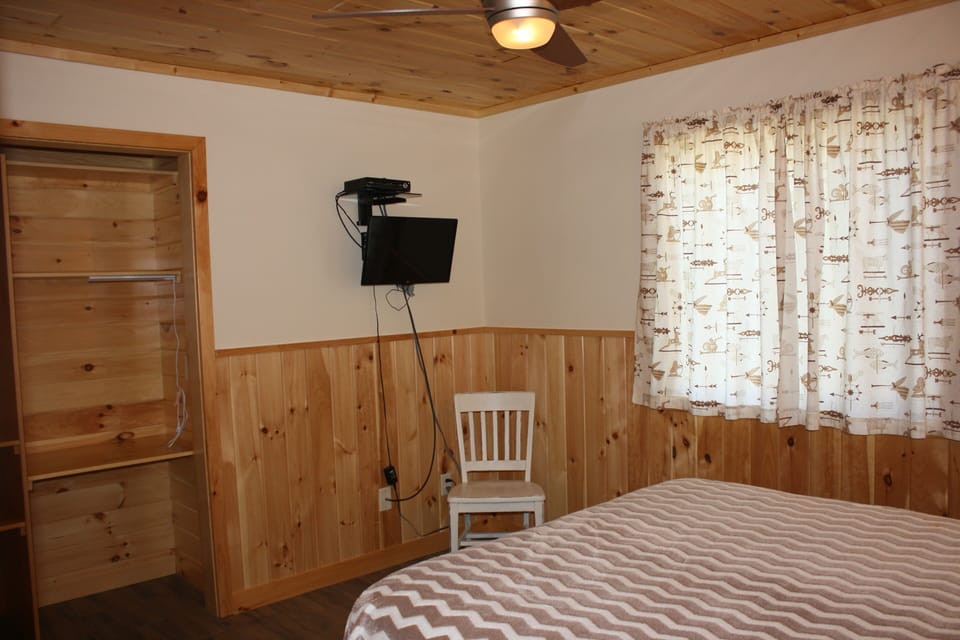 One of two bedrooms, queen beds, T.V. and one with a on suite full bath with tub