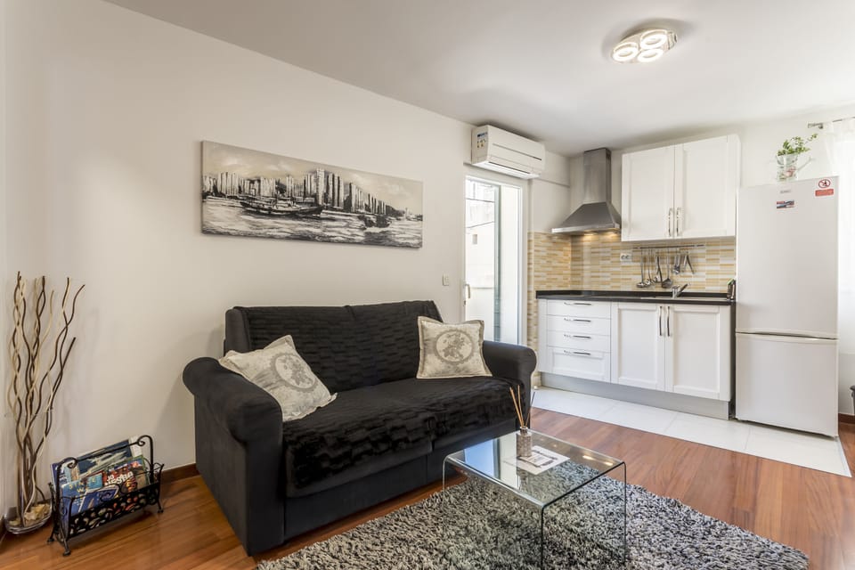 Living room with sofa bed for one bedroom. 