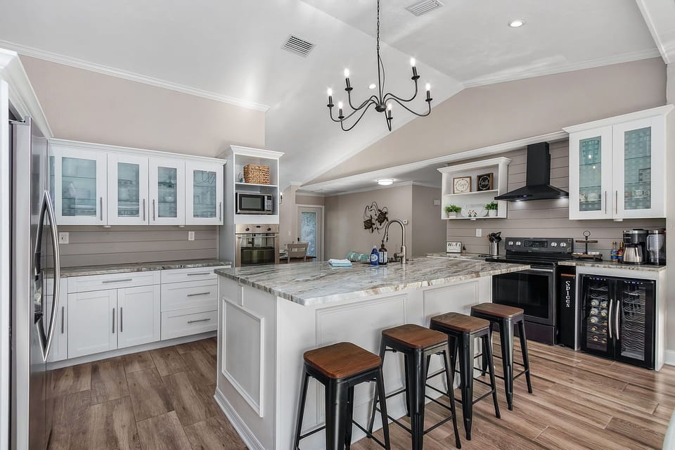 Kitchen and central island with extra seating.