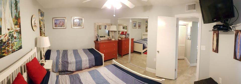 Guest Bedroom with Double Bed & Twin/Single Bed and wall mounted 32" HDTV & DVD