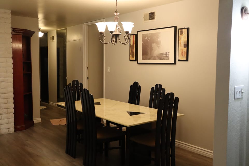 dining for 6 people, plus 4 stools in kitchen island