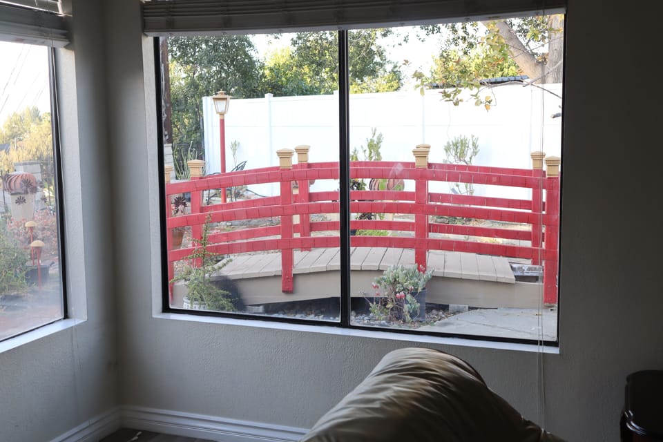 view of the backyard/red bridge from family room 