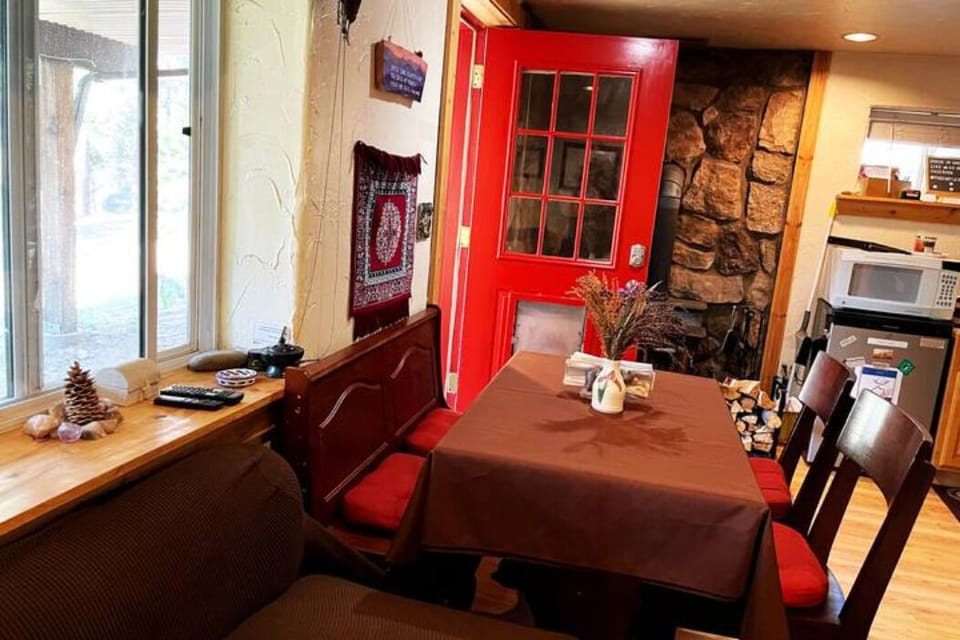 downstairs seating area, kitchenette, fireplace and access to outdoors