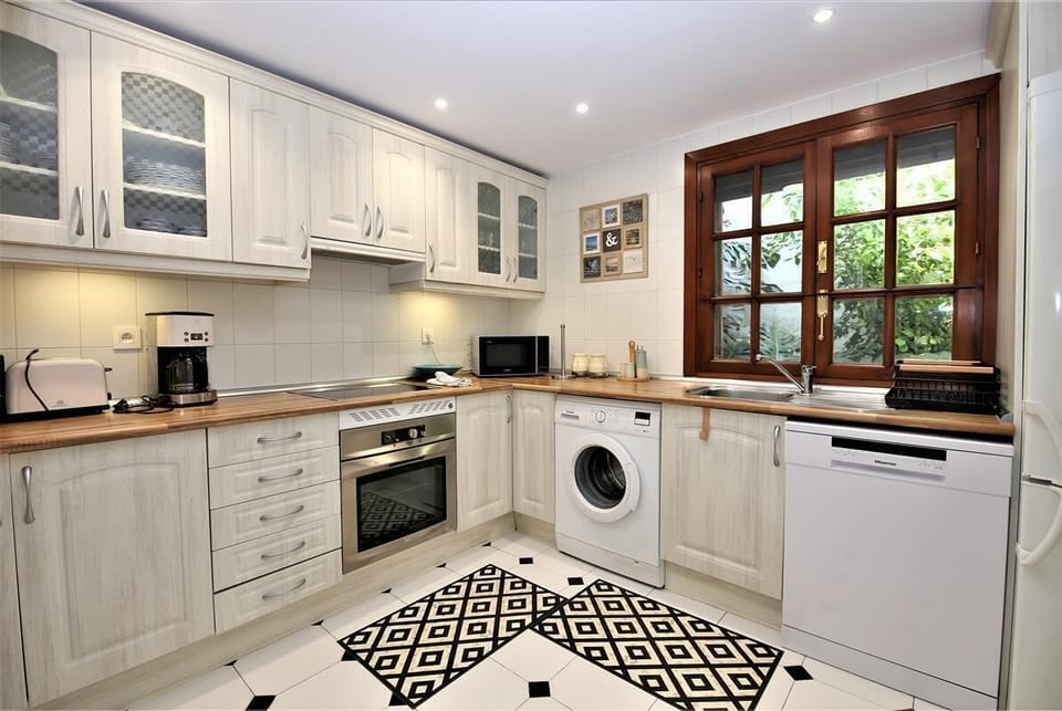 Modern and spacious kitchen is fully fitted with all the appliances