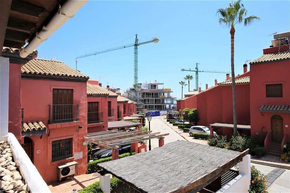 Views from the balcony to the quiet street, beach access is at the end of the road