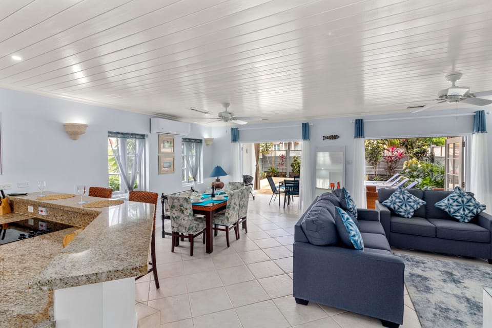 Open plan living area with double french doors to the covered patio area