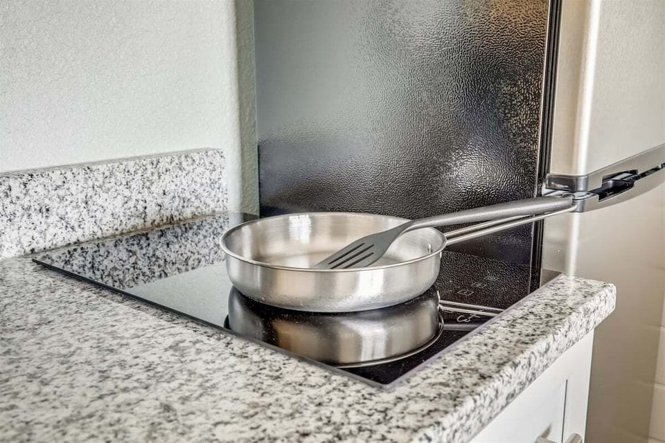 A compact cooktop set into granite counters for light, easy cooking.