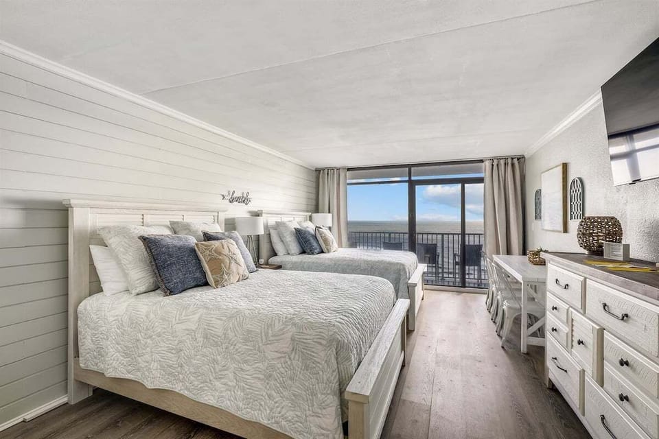 A beautifully appointed space set up for restful nights by the ocean.