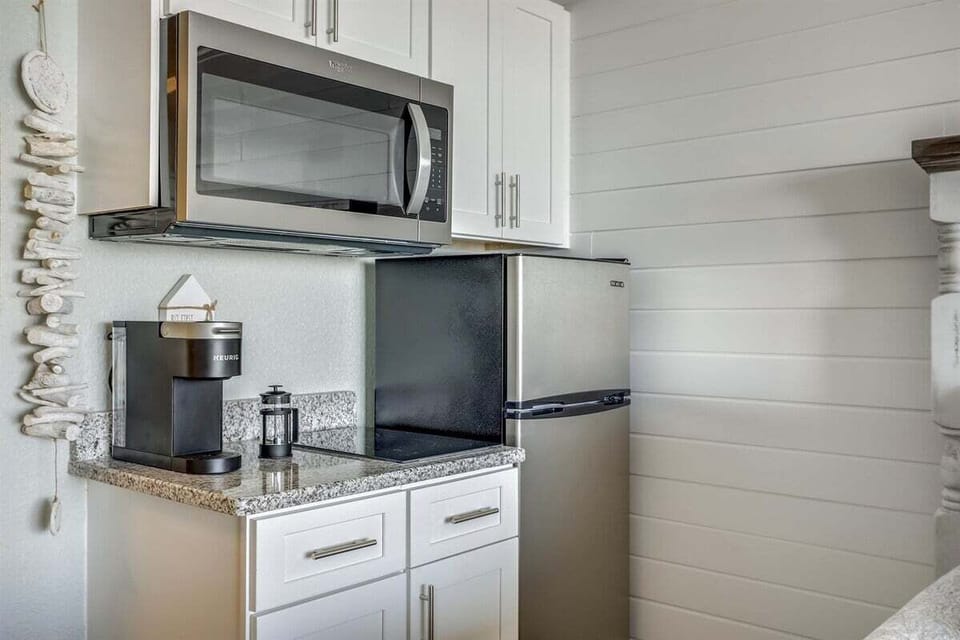 A compact kitchenette set up for simple meals and easy mornings in between beach time.
