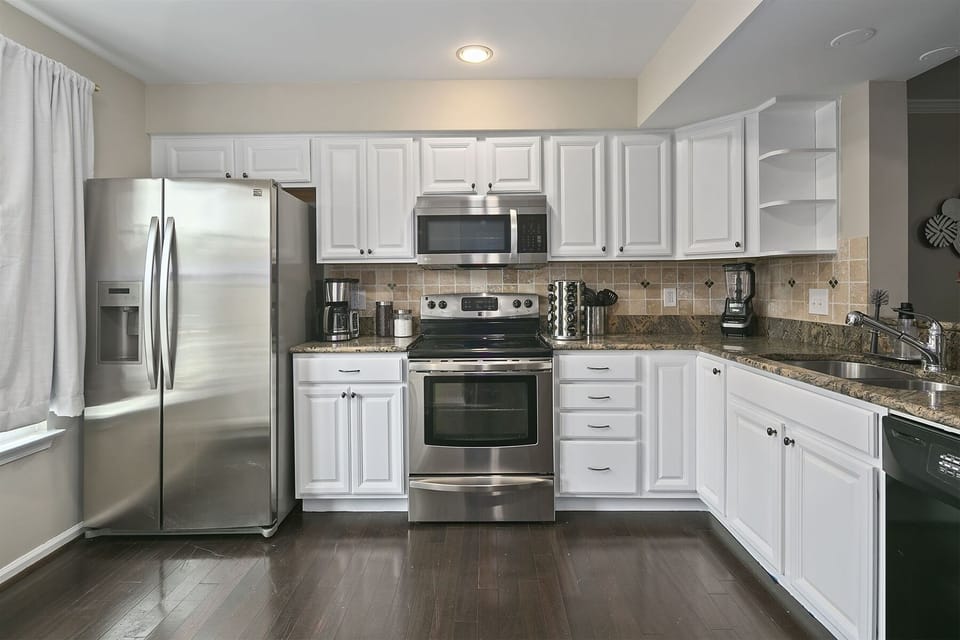 Top-of-the-line appliances include an electric range w/ convection oven