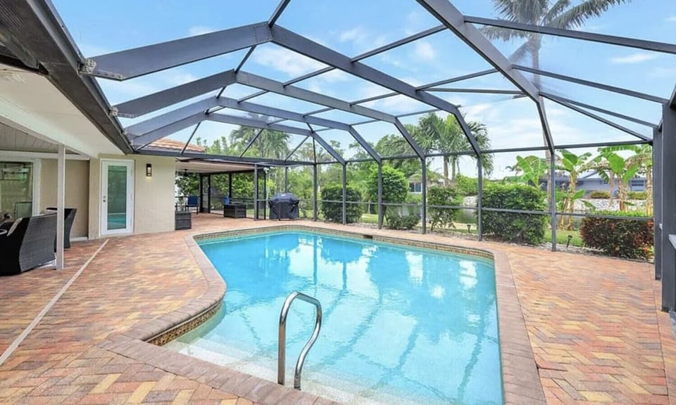 Take a dip in your private screened pool under the Florida sun