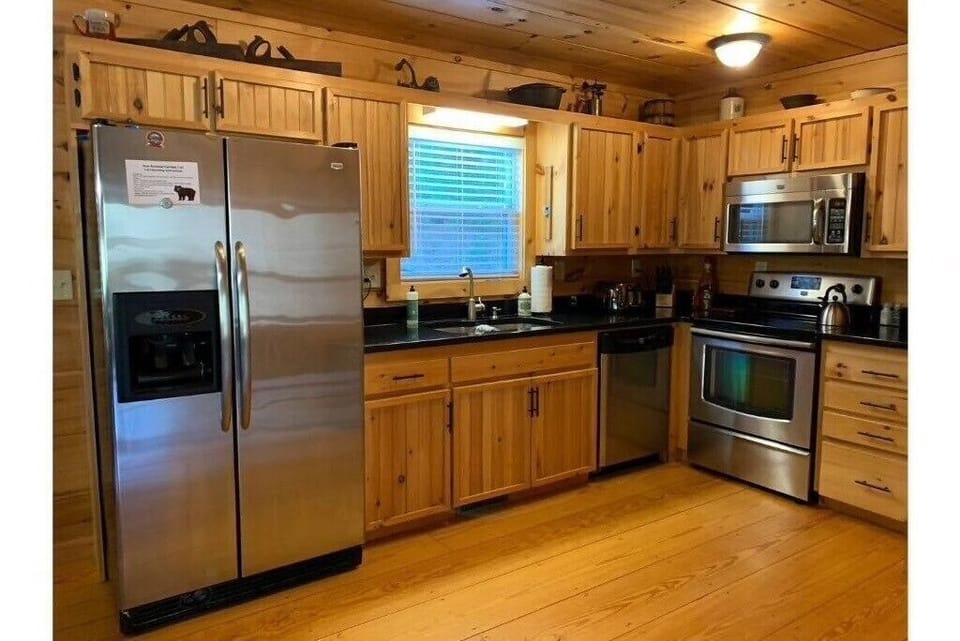 Fully equipped kitchen with stainless steel appliances and granite countertops