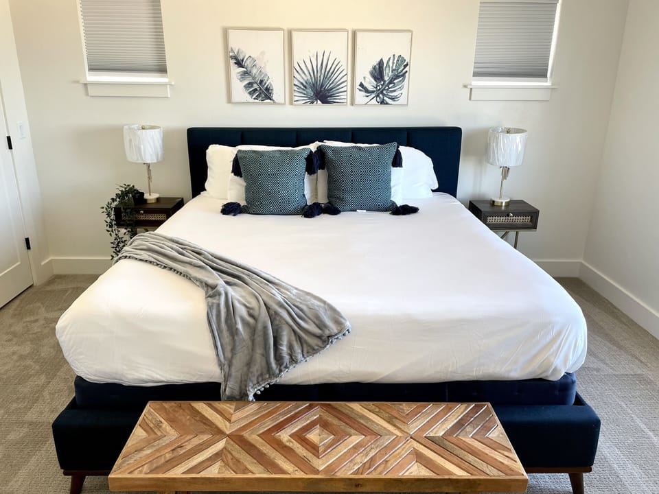 Main floor primary suite. En suite bathroom. Lake view from bed.