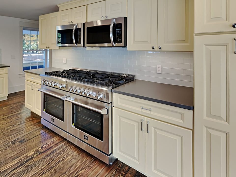 Kitchen with 2 Ranges, 2 Micros, 2 Dishwashers & 2 Refrigerators