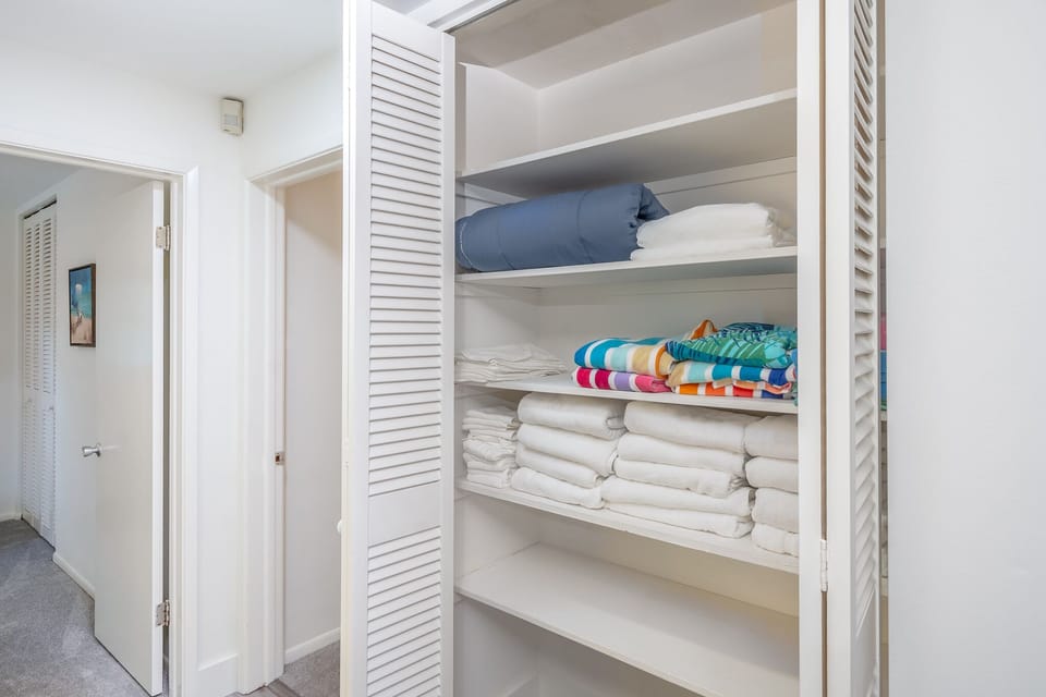 There is a large linen closet with extra bedding, white towels and beach towels.