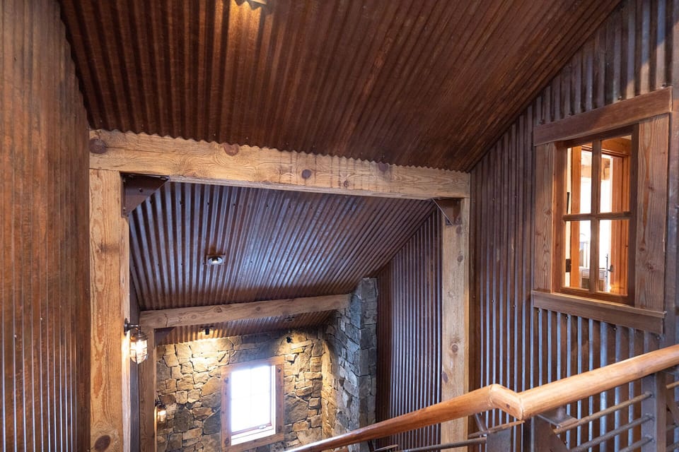 The mix of Industrial decor and log cabin feel creates the perfect ambiance for this stunning modern chalet.