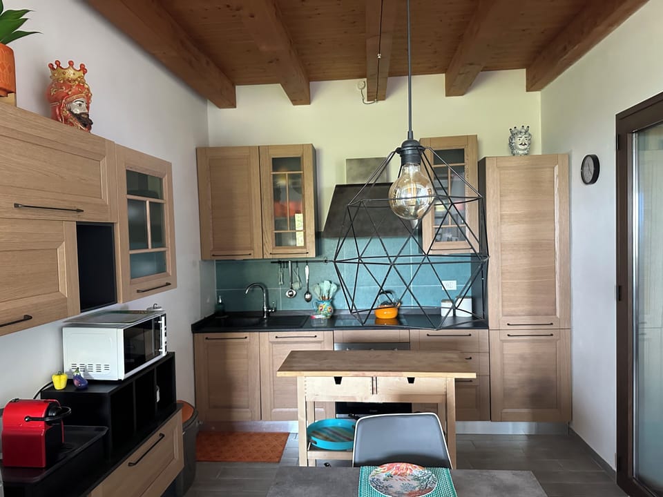 Fully equipped kitchen with stove, oven, dishwasher and a refrigerator.
