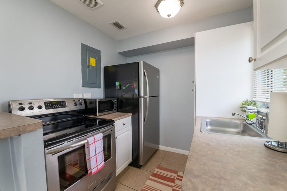 Fully stocked kitchen with new, full-sized appliances