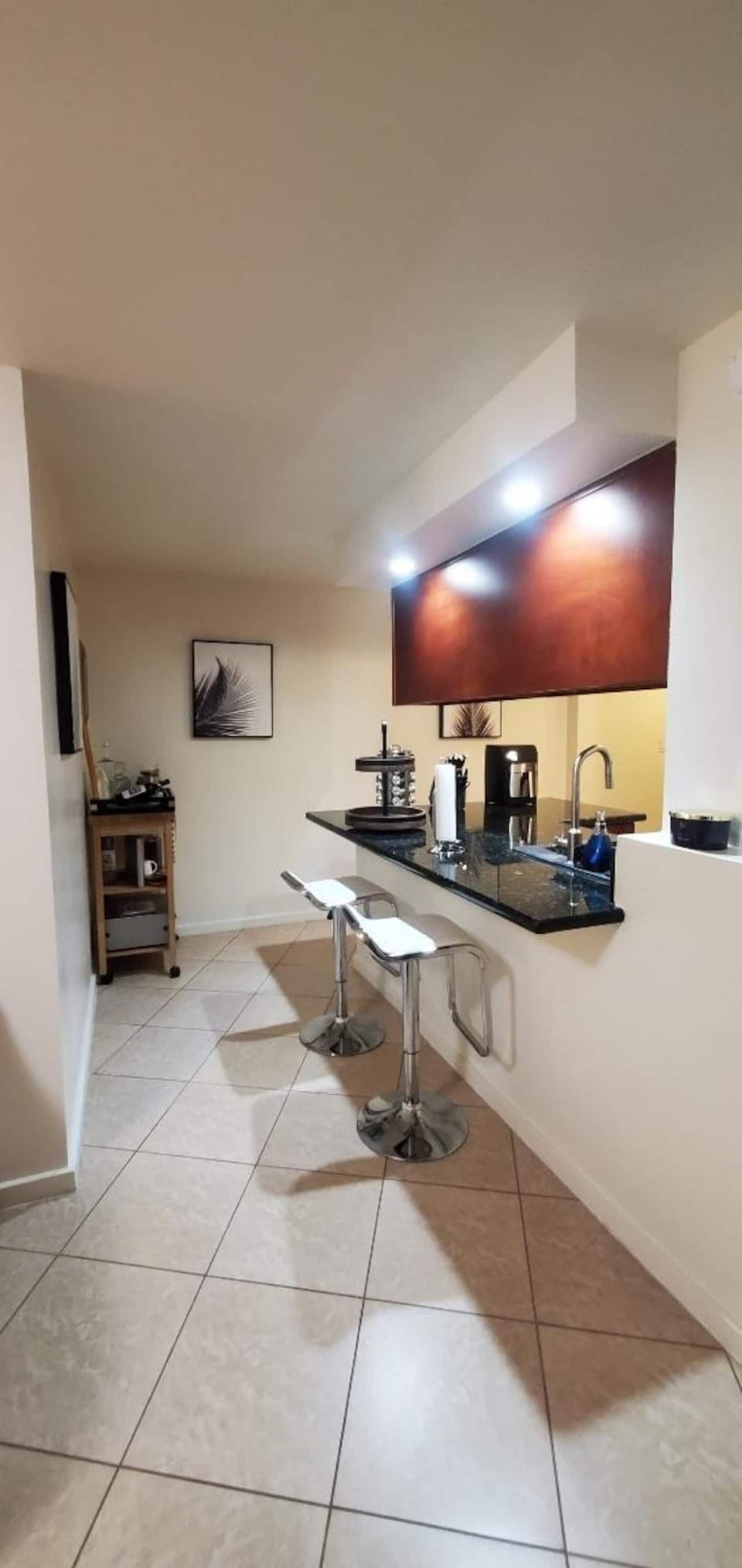 Open corridor for access from bedrooms into kitchen. 