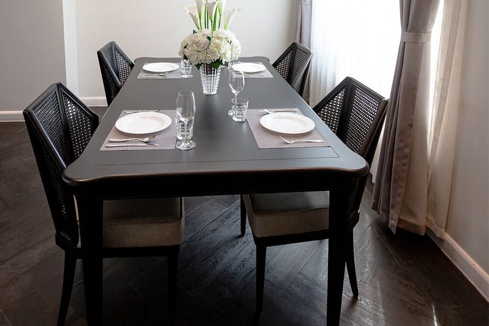 Fully setup dining table with glass wine