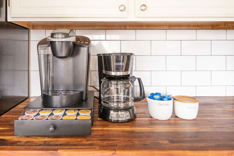 Coffee station with Keurig and drip options, K-cups, cream, and sugar all included