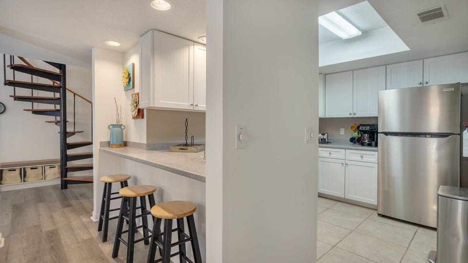 Countertop with three barstools
