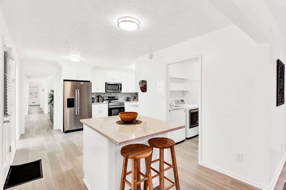 Open Kitchen w/stainless steel appliances,island,access to Garage -MainLevel