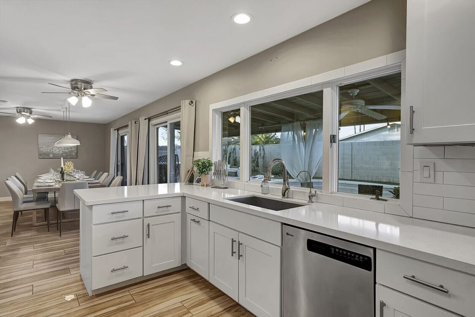Cook in style with a view of our backyard pool in our spacious open kitchen