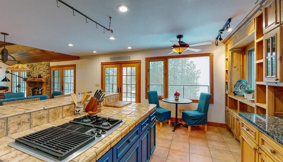 Cook memorable meals in this spacious gourmet kitchen, where warm wood cabinets and granite counters create your perfect culinary retreat.