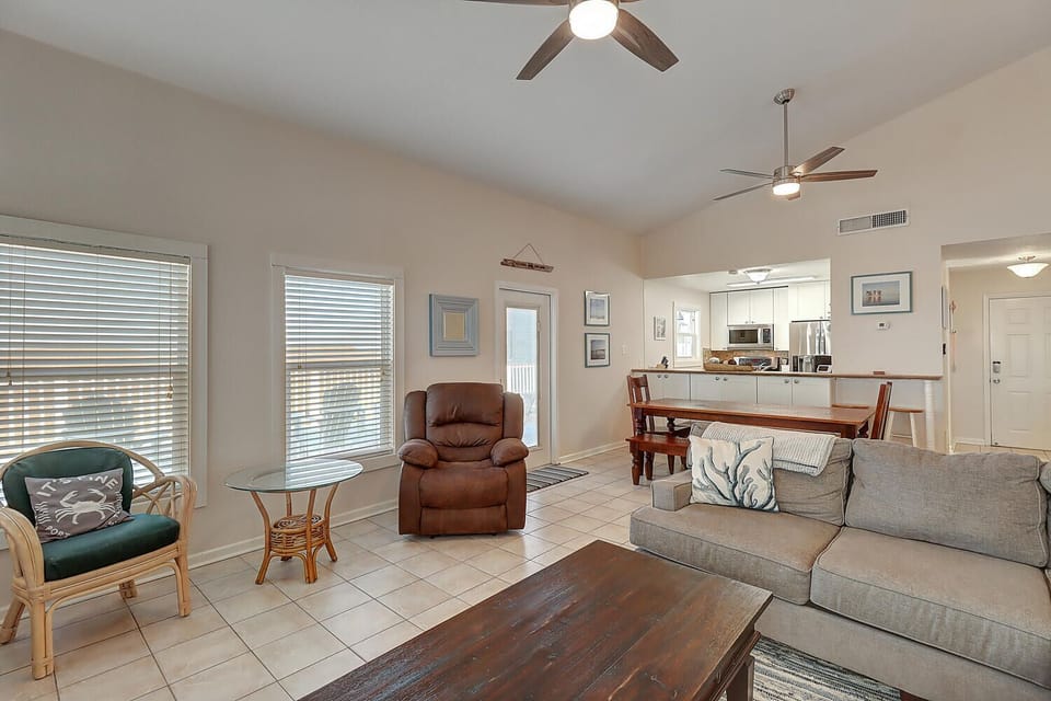 Relax in your bright, open living space with comfortable seating and modern fans keeping you cool.