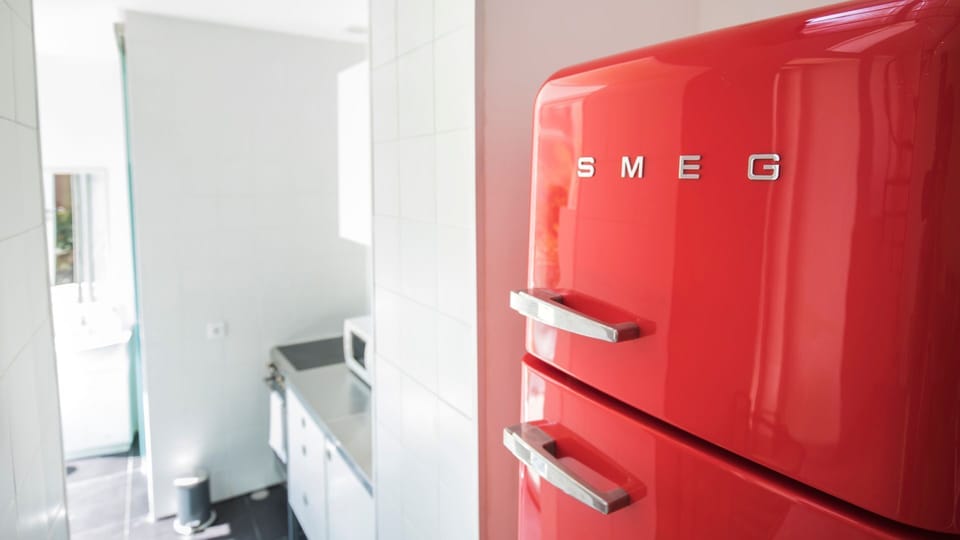 A well-equipped kitchen with ample appliances
