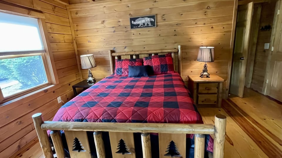 The bear room features a queen size bed, closet and LED TV.
