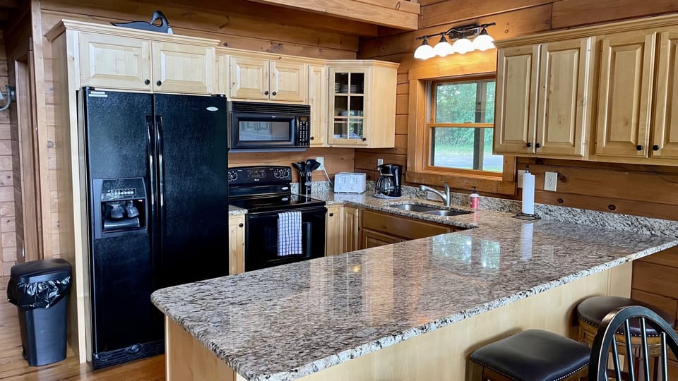 The kitchen is stocked with all the utensils and appliances you need!