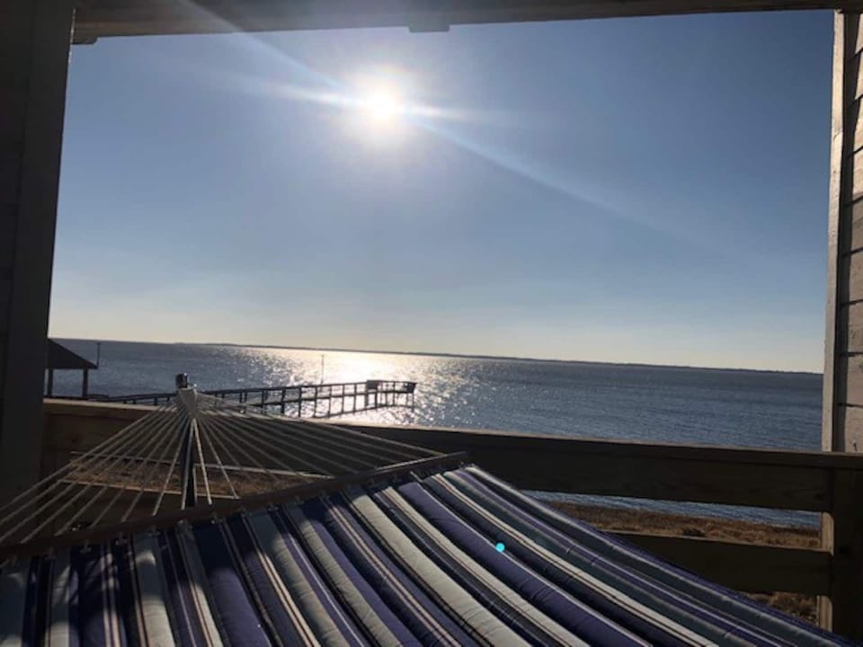 Relax and enjoy water views and sunsets from the hammock on the deck.