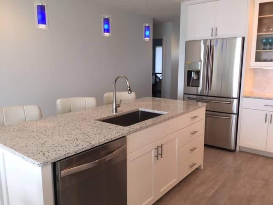 Great gathering space in the beautiful and fully stocked kitchen.