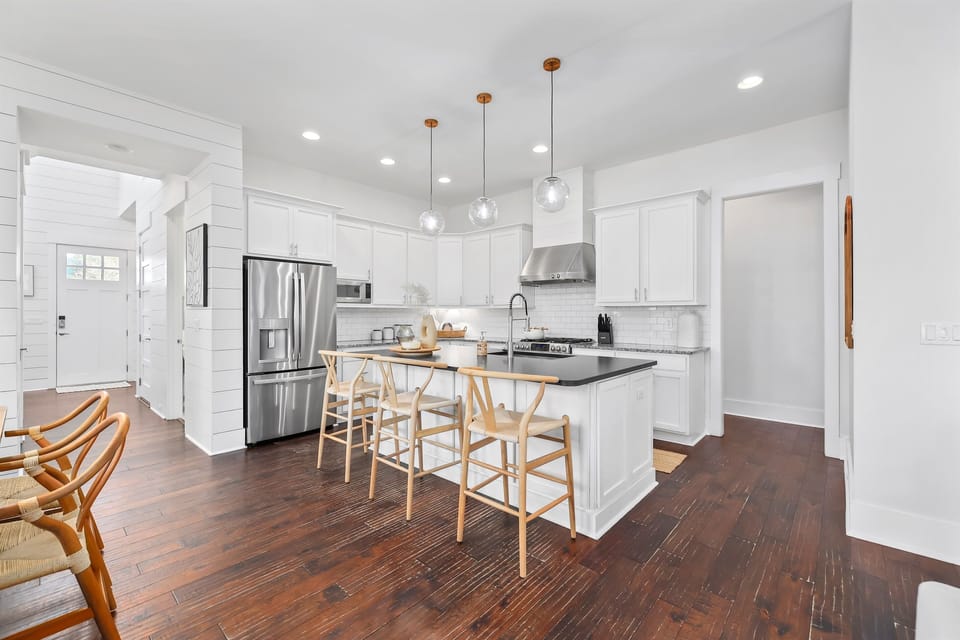 Gourmet kitchen with island seating and stainless appliances